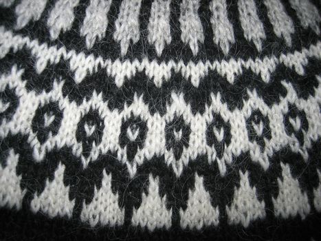 Macro of a handmade wool sweater with old pattern