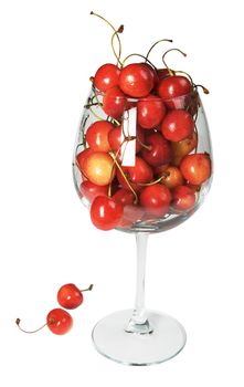 The big glass filled by a sweet cherry