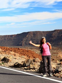 Girl Backpacking / Hitchhiking on Teide, Tenerife. Mixed chinese / caucasian woman model.