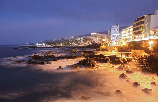 Tenerife - Puerto de la Cruz. Long exposure night scene showing the waterfront.