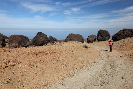 Teide landscape on Tenerife with woman hiking. Lots of copy space.