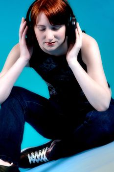 Red haired girl listening to her favourite music