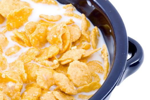 a bowl of cornflakes with milk - healthy diet