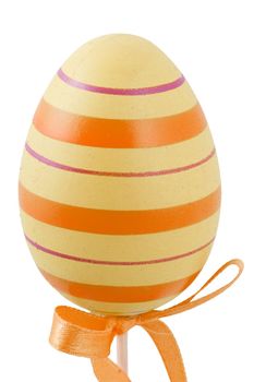 a yellow and orange easter egg isolated on the white background