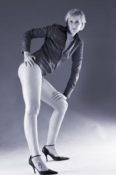 Short haired blond with long legs showing her long legs