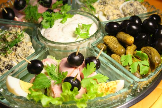 Olives, gherkins and the stuffed eggs on the big dish.
