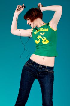 Red haired girl listening to her favourite music