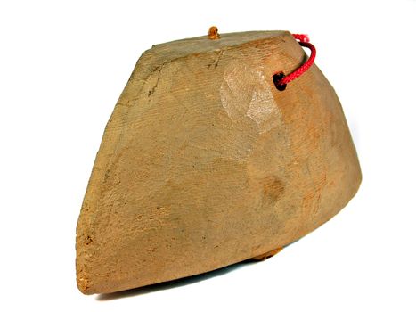 Handmade primitive African wooden bell isolated on white