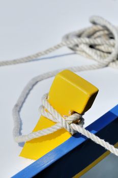 Close-up of a tied-up rope securing boat to dock