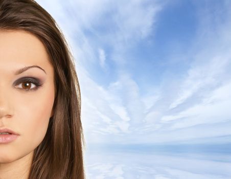 Attractive latino woman over sky with a lot of copy-space     