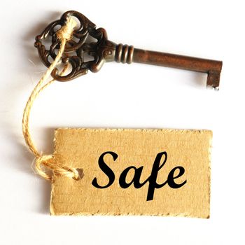 safe concept with key and label showing secure investment