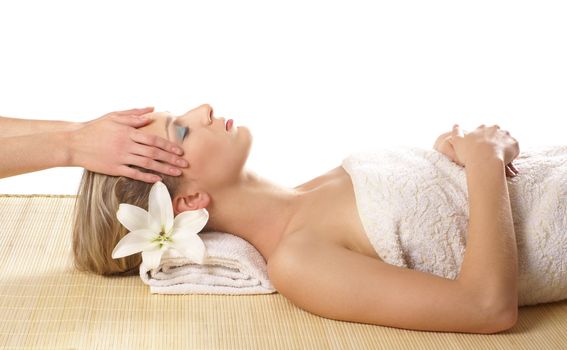 Attractive woman getting spa treatment isolated on white