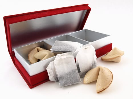 Tea bags and fortune cookies in a Red gift box isolated on a white background