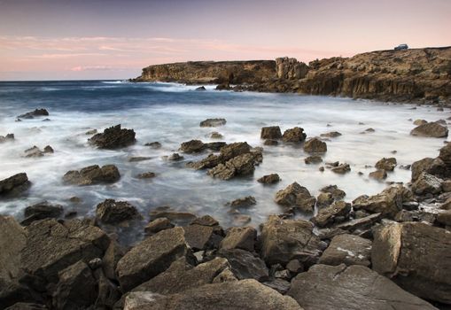 Picture of the sunset with beautiful rocks on the ocean