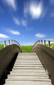 Wooden bridge ending in a beautiful green meadow (blur effect on the sky)