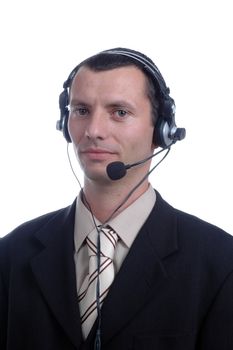 young businessman in headphones speaks on microphone on white background