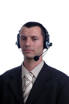 young businessman in headphones speaks on microphone on white background