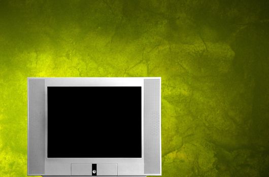 TV with a green wall background