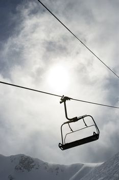 Empty chair lift at ski resort.