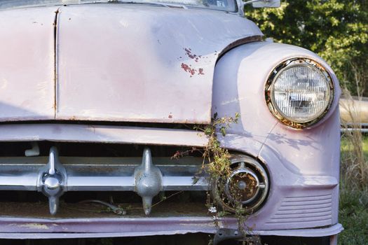 Front end of old abandoned car.