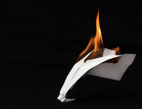Paper airplane in flames 