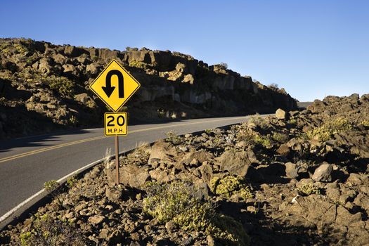 Road and curve in road sign in Haleakala National Park, Maui, Hawaii.