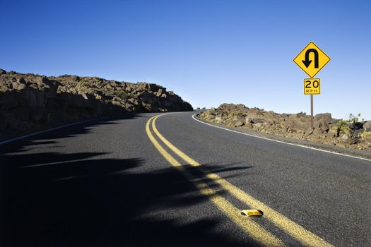 Road and curve in road sign in Haleakala National Park, Maui, Hawaii.