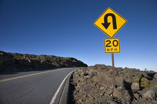 Road and curve in road sign in Haleakala National Park, Maui, Hawaii.