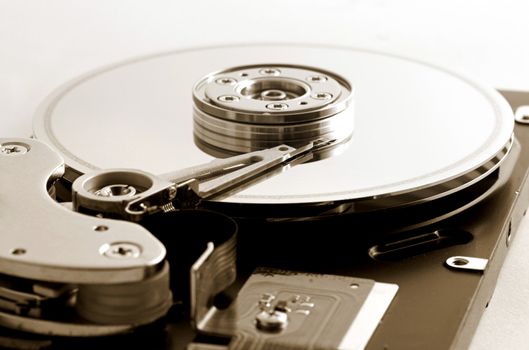 Open hard disk drive - shallow depth of field with focus on the needle