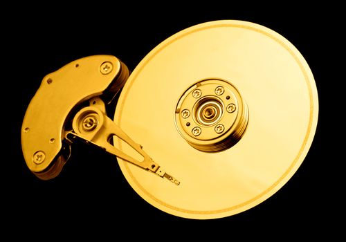 Open hard disk drive, with a golden tone