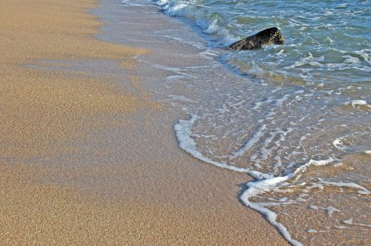 Footprints going over a sand dune