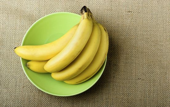 Bananas in a green plate