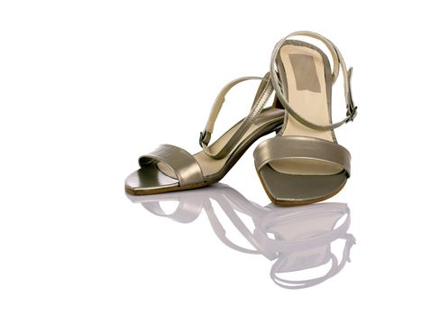 Beautiful feminine sandals on white with reflection