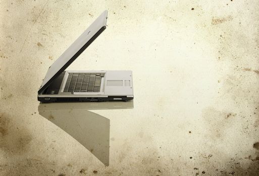 Picture of a laptop on a white background with a grunge background

