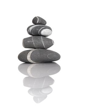 Stack of balanced stones on a white background