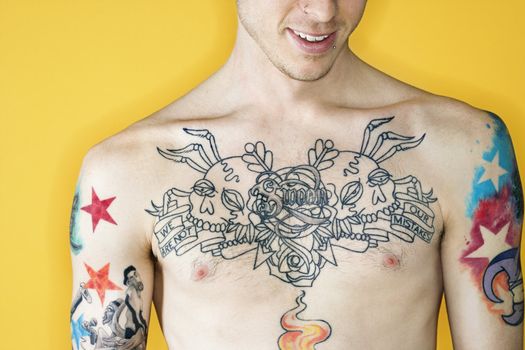 Tattooed male Caucasian young adult chest.