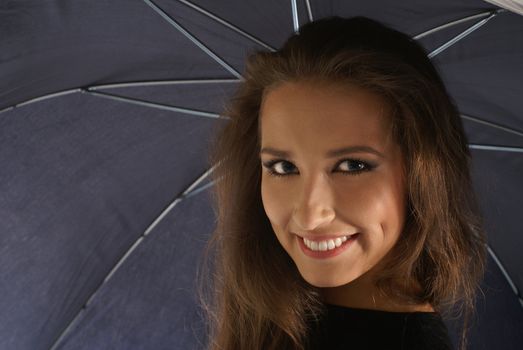 Young lovely georgian woman with umbrella isolated on white              