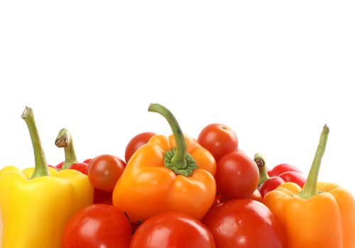 Tomatoes and paprika rotated and isolated on white                