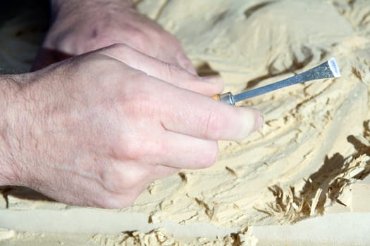 Hands of the carver