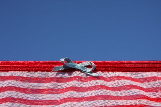 Clothes on washing laundry line, red lingerie, blue sky