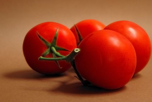 Bunch of red, regular size tomatoes.