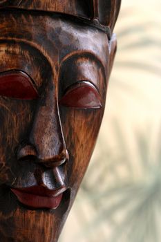 Ethnic hand carved wooden mask with copy space.