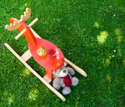 Muffin and juice with toys prepared for a snack.