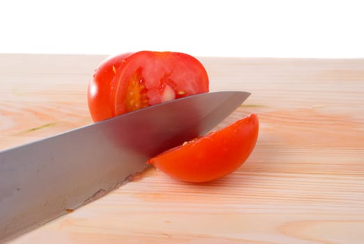 tomatoes and knife on wood table