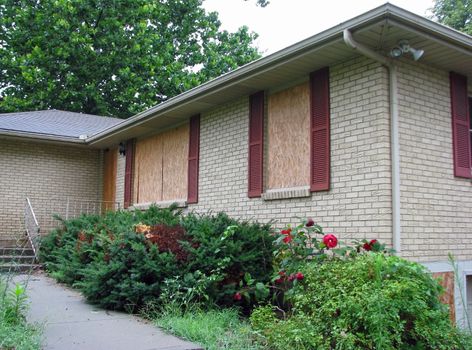 Houses boarded up due to foreclosure - the Mortgage Crisis.
