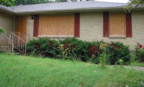 Houses boarded up due to foreclosure - the Mortgage Crisis.
