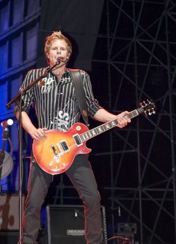 Duran Duran guitarist Dom Brown live on stage in Malta on 26th July 2008 during Red Carpet Massacre Tour