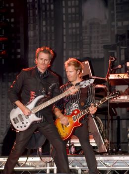 Duran Duran bassist John Taylor and guitarist Dom Brown live on stage in Malta on 26th July 2008 during Red Carpet Massacre Tour