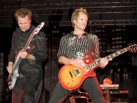 Duran Duran bassist John Taylor and guitarist Dom Brown live on stage in Malta on 26th July 2008 during Red Carpet Massacre Tour