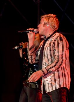 Duran Duran frontman and vocalist Simon Le Bon and backing vocalist Anna Ross live on stage in Malta on 26th July 2008 during Red Carpet Massacre Tour